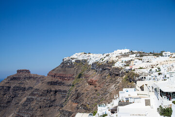 Fototapeta na wymiar White villages on the clifftops of the caldera of Santorini