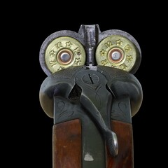 12 gauge vintage shotgun loaded and isolated on black Macro.