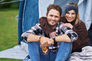 Young nice couple having fun on camping