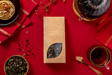 Organic tea branding and packaging mockup. Blank tea packaging mockup with tea. Kraft paper pack with window and empty space to display your branding design.