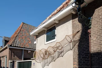 Poster Fishing nets on a wall in Elburg, Gelderland Province, The Netherlands \\ Visnetten aan een muur in Elburg, Gelderland Province, The Netherlands © Holland-PhotostockNL