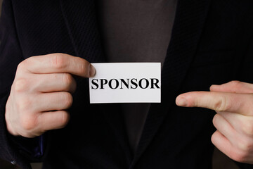 Business concept. Paper with text SPONSORS WELCOME, near a calculator, chart,magnifier