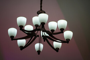 chandelier. lighted chandelier made of wood. electricity. photo inside.