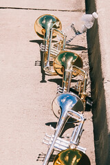 Fototapeta na wymiar row of resting trumpets during marching practice