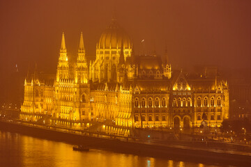 Hungarian parliament and Danube on a foggy night. Budapest