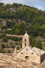 Fototapeta na wymiar Traditional stone church in Bunyola village, Mallorca. Balearic islands, Spain