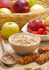 Oatmeal cereal bowl and ears of corns on fruit ingredients background.