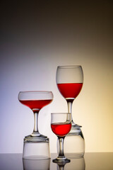 Glassware of different sizes against monochrome background