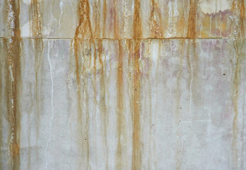 Old stone wall. Water stains on the wall. Structure of concrete. The old wall.
