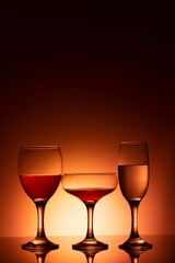 Glassware of different sizes against colorful background