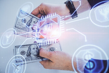 Multi exposure of technology drawing hologram and us dollars bills and man hands. Data concept