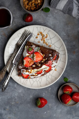 chocolate crepes with cream cheese and strawberries