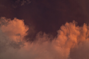 Fototapeta premium Red clouds in the evening sky were hit by sunlight, Summer sky, Soft focus.