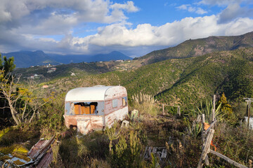 Old abandoned rusted roulotte Rv van
