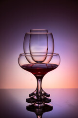 Glassware of different sizes against colorful background