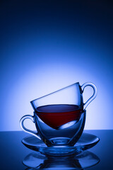 Two cups of tea against colorful background