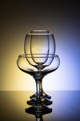 Glassware of different sizes against colorful background