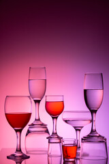 Glassware of different sizes against colorful background