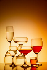 Glassware of different sizes against colorful background