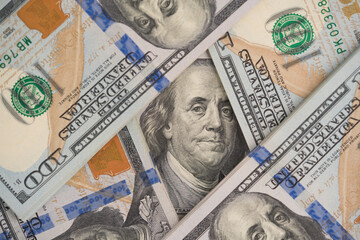 Closeup view of one hundred dollars banknotes as financial background. Cash money. Financial growth...