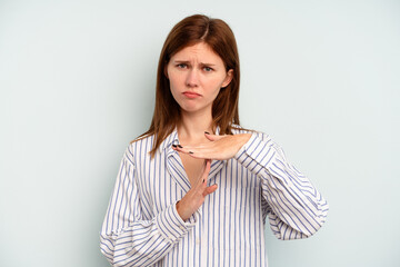 Young English woman isolated on blue background showing a timeout gesture.