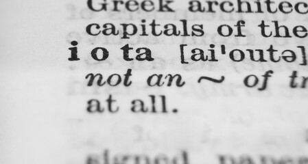 Greek letter Iota dictionary definition close-up. Shallow depth of field.