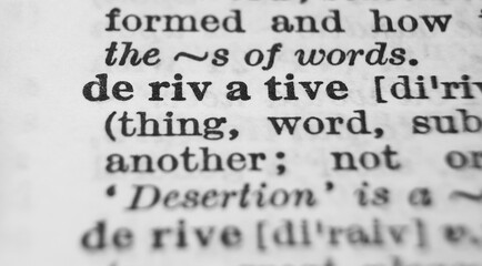 Obraz premium Derivative dictionary definition close-up. Shallow depth of field.