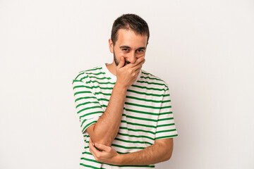 Young caucasian man isolated on white background laughing happy, carefree, natural emotion.