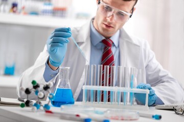 Fototapeta premium Medical Research Laboratory, Female Scientist Using Micro Pipette for Test Analysis.