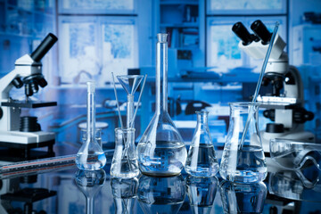 Laboratory investigations concerning test and medicine against covid. Microscope, glass tubes and...