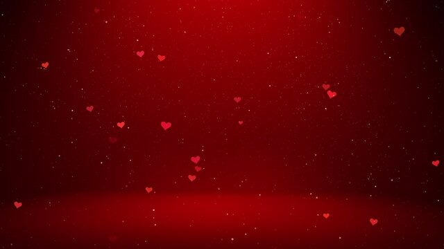 Flickering small hearts on red copy space background with falling shimmering glitter effect seamless loop valentine's day concept background.