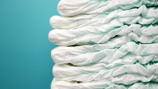 stack of baby diaper on table,