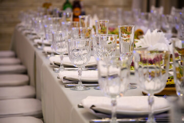 Banquet table served for guests. Cutlery and food at the reception party.