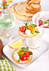 Round crispbread toast with greens and vegetables. Healthy food concept.