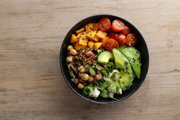 Fresh tasty healthy poke bowl on wooden