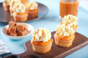 Homemade cupcakes with caramel syrup and whipped cream cheese