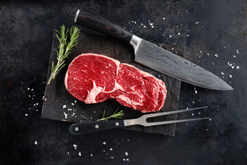 Fototapeta na wymiar Fresh meat beef on dark background