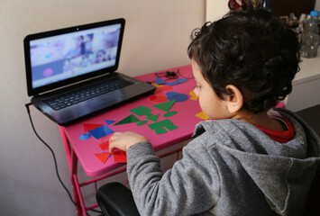 Little boy in virtual classes