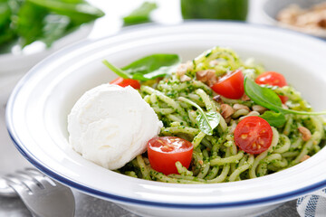 Pasta with spinach pesto, cashew nuts and soft cream cheese