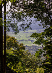 Mountain landscape with green expanses and rural houses looking view from mountain path. Summer, No focus, specifically.