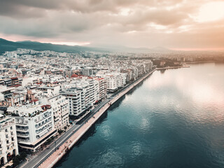 Obraz premium Aerial panorama over the promenade of Thessaloniki city with facades of buildings and a walking pedestrian path along the sea. Visit Greece and sightseeing concept