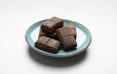 Blue plate with delicious and healthy hematogen on white table