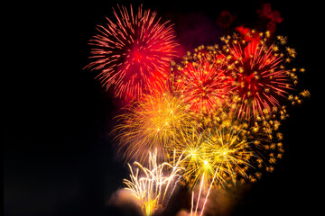 beautiful golden and red firework display set for celebration happy new year and merry christmas and  fireworks on black background