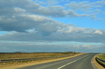 Asphalt road leading into the distance.