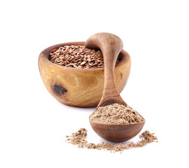 Flax flour in wooden spoon with flax seeds  on white background.