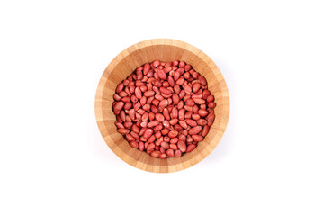 Bamboo bowl full of organic redskin peanuts 