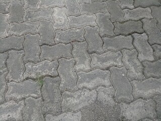 cracked and dirty brick paving roads