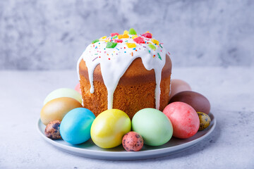 Easter cake with candied fruits and colored eggs. Traditional Easter baking. Easter holiday. Close-up.