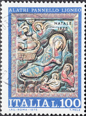 Italy - circa 1975: a postage stamp from Italy showing christ in the stable. Nativity. Christmas Postage stamp 1975