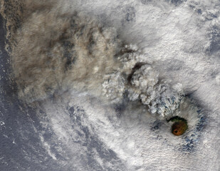 Volcano eruption with smoke and hurricane clouds, satellite view. Collage. Elements of this image...
